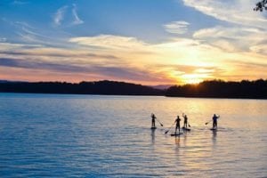 people having fun on lake blue ridge sunset