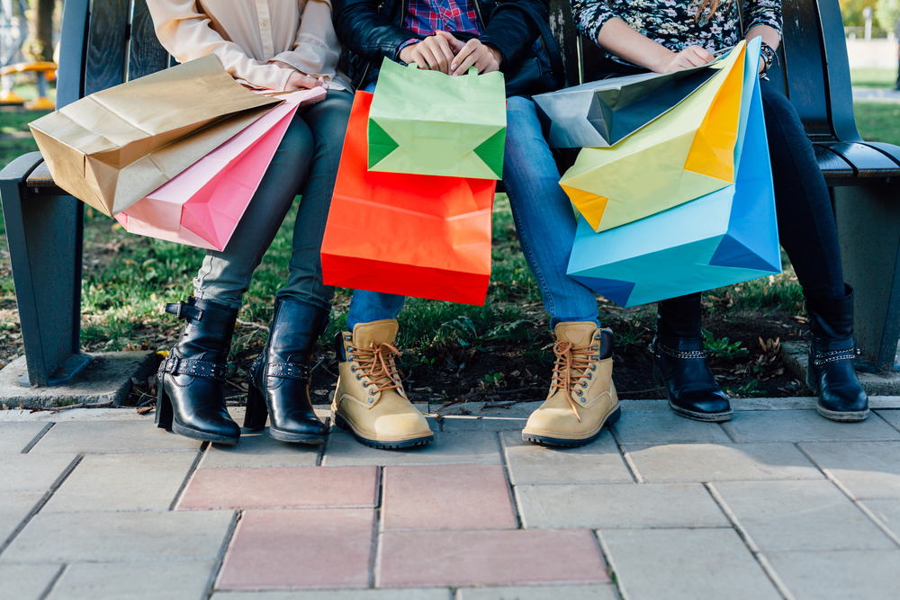 people with gift shop bags